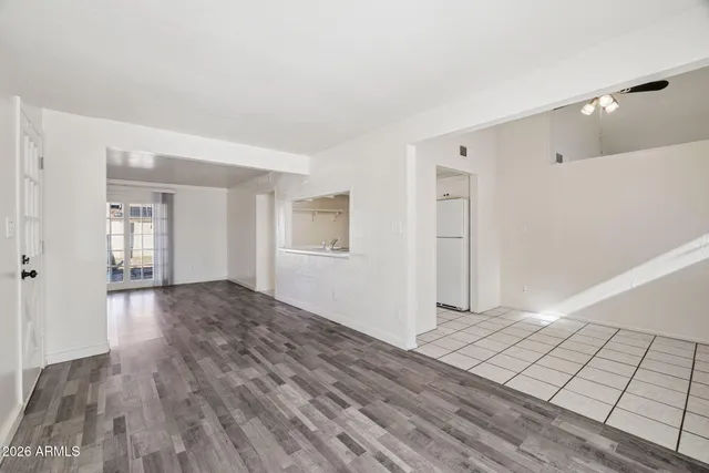 a view of a room with wooden floor