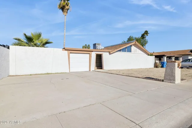 a view of an house with a street