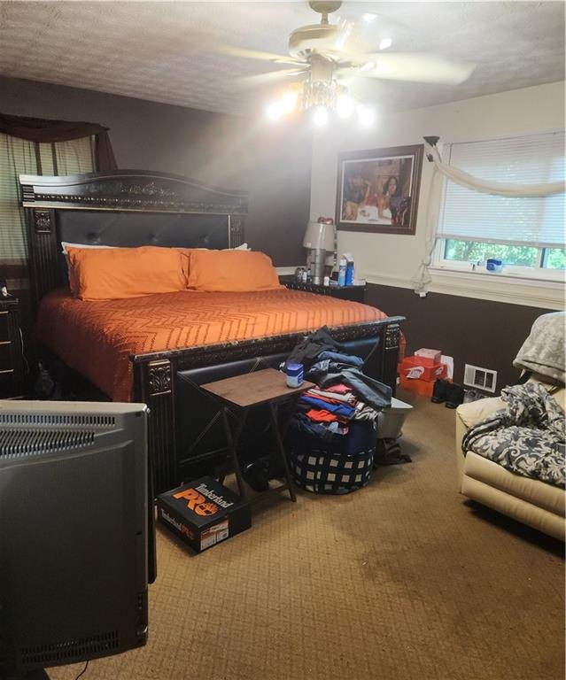 3389 Boring Road Decatur, GA 30034 - Photo 11 of 14 a bedroom with furniture and a chandelier