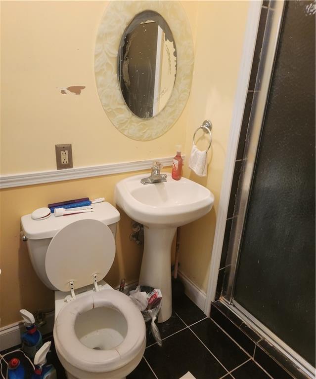 3389 Boring Road Decatur, GA 30034 - Photo 12 of 14 a bathroom with a sink mirror and toilet