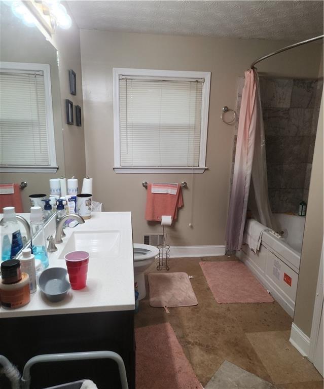 3389 Boring Road Decatur, GA 30034 - Photo 14 of 14 a bathroom with a sink a toilet and a mirror