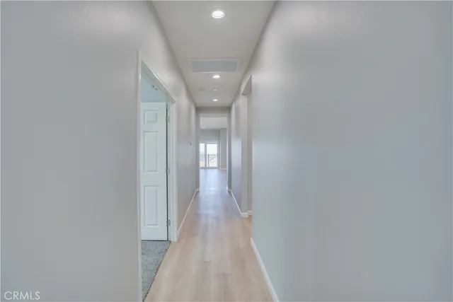 a view of an empty room with a cabinet