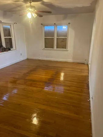 a view of room with wooden floor
