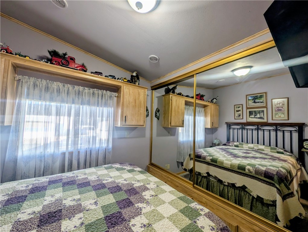 2000 Ramar Road, Unit 89 Bullhead City, AZ 86442 - Photo 13 of 26 Bedroom featuring a closet and light wood-style flooring