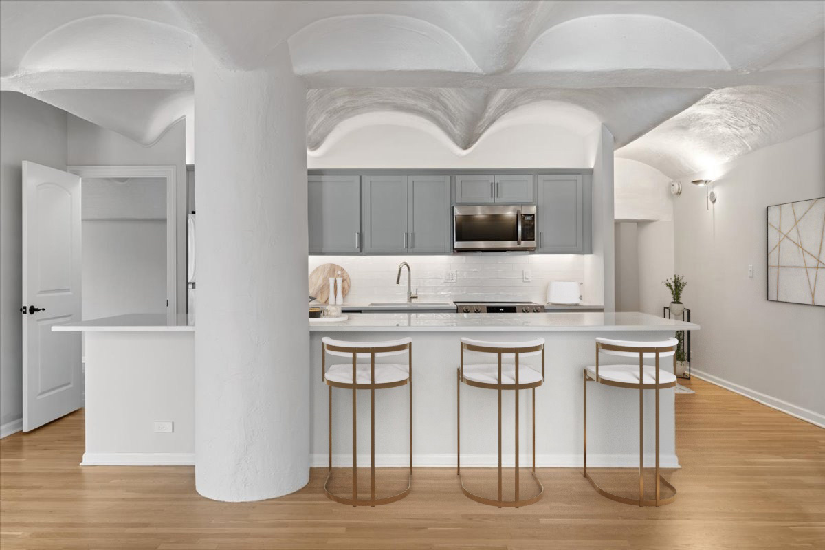 345 North Canal Street, Unit 608 Chicago, IL 60606 - Photo 5 of 27 a kitchen with a sink cabinets and wooden floor