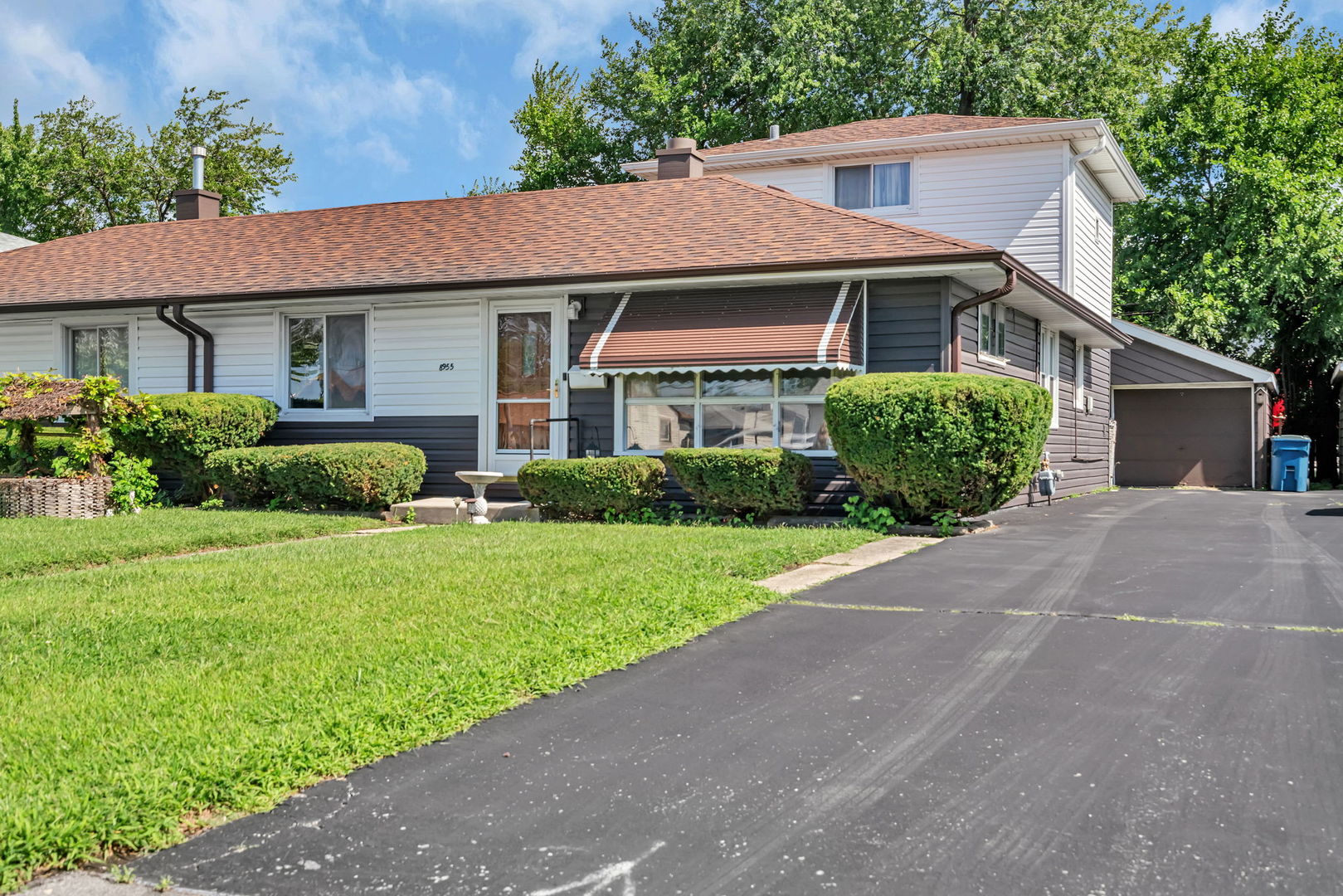 8955 South Corcoran Road Hometown, IL 60456 - Photo 1 of 20 a front view of a house with garden