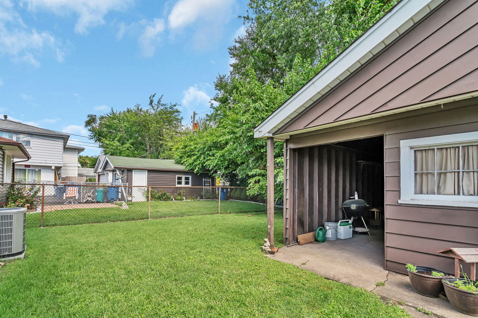 8955 South Corcoran Road Hometown, IL 60456 - Photo 18 of 20 a view of a house with a backyard