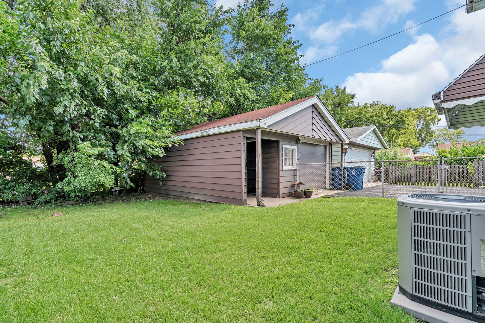 8955 South Corcoran Road Hometown, IL 60456 - Photo 19 of 20 a front view of house with yard and green space