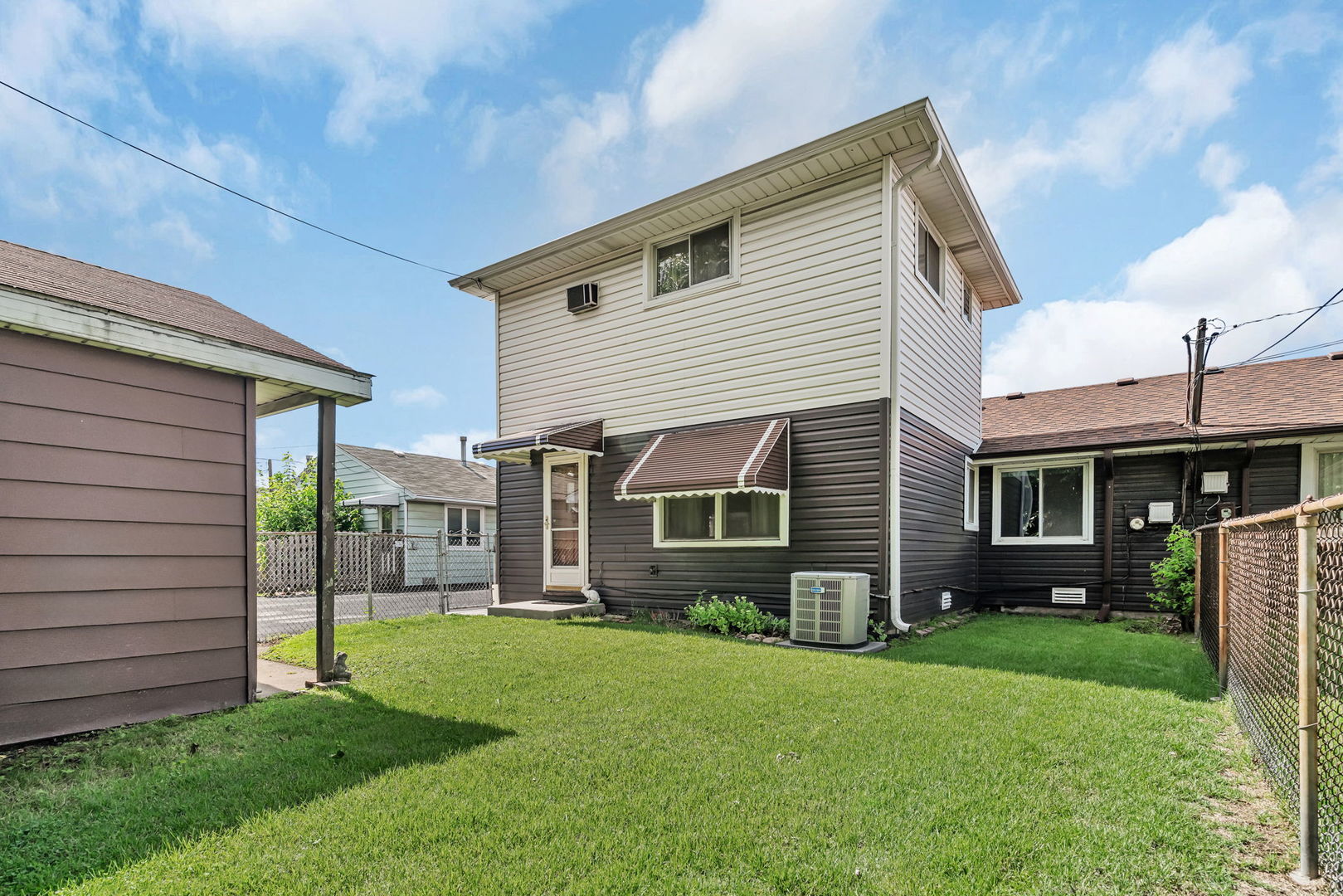 8955 South Corcoran Road Hometown, IL 60456 - Photo 20 of 20 a view of a house with a yard and plants