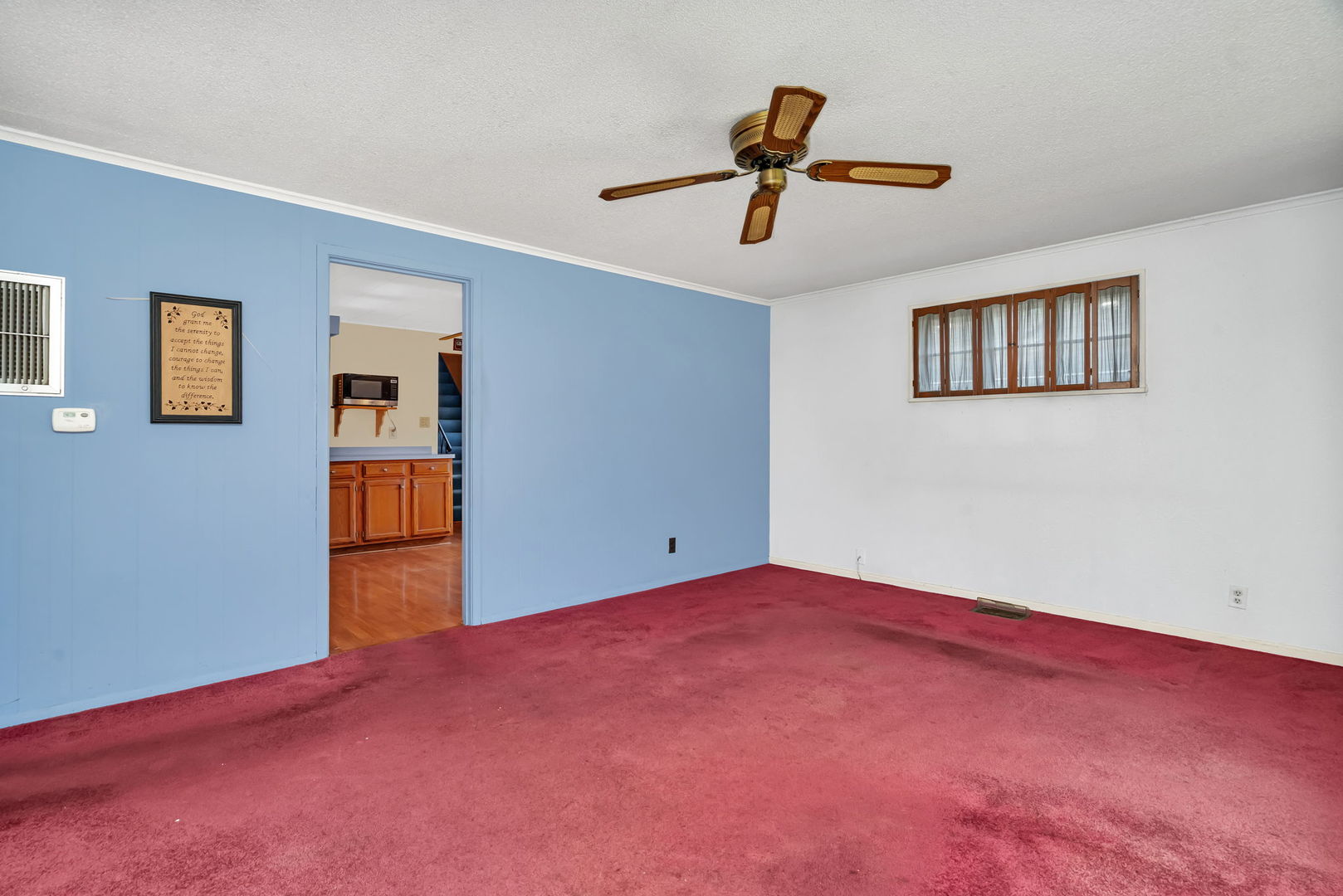8955 South Corcoran Road Hometown, IL 60456 - Photo 3 of 20 a view of a livingroom with a ceiling fan and window