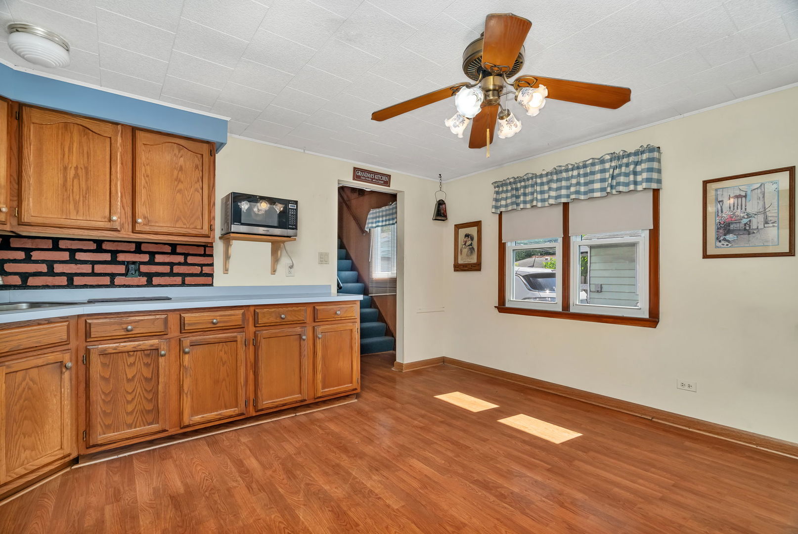 8955 South Corcoran Road Hometown, IL 60456 - Photo 6 of 20 a kitchen with stainless steel appliances granite countertop a stove a sink dishwasher and a microwave oven with cabinets