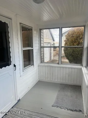 a view of a hardwood & staircase in a room