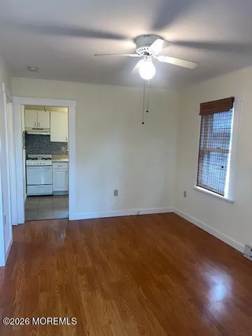 a view of a kitchen with a sink and a stove top oven