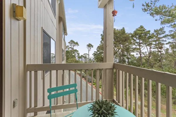 a balcony with wooden floor