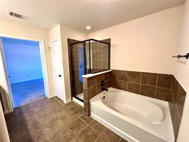 a view of hallway with stairs and wooden floor