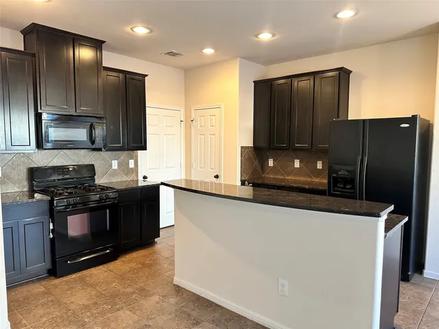 a view of a livingroom with a furniture
