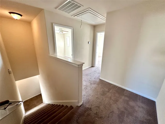 a view of a pathway with a garden