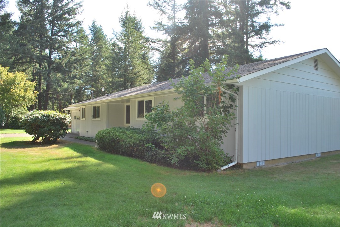 5205 185th Avenue Southwest Rochester, WA 98579 - Photo 2 of 17 a view of a house with a yard
