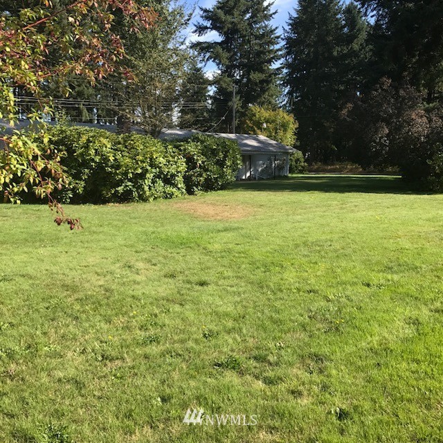 5205 185th Avenue Southwest Rochester, WA 98579 - Photo 16 of 17 a view of outdoor space with deck and trees