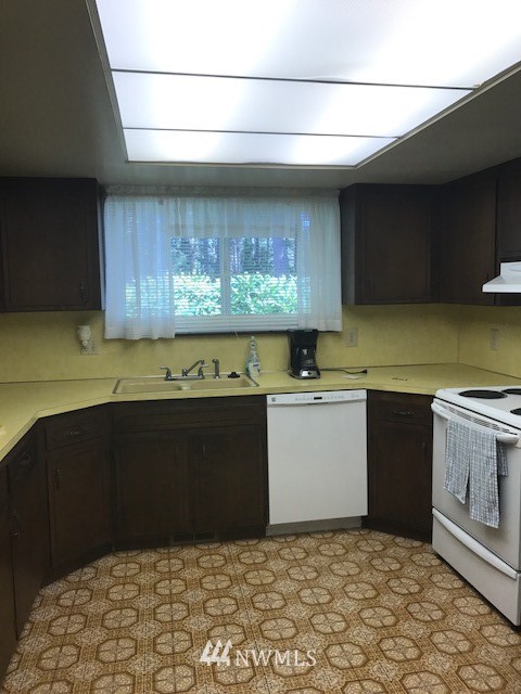 5205 185th Avenue Southwest Rochester, WA 98579 - Photo 8 of 17 a kitchen with a stove and a cabinets
