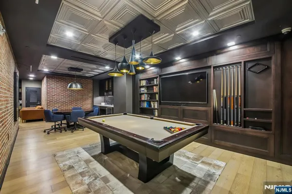 a living room with dining table furniture and a large window