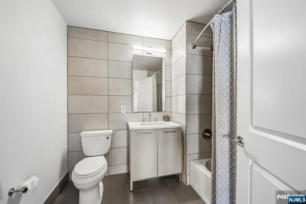 a view of a storage & utility room with dryer and washer