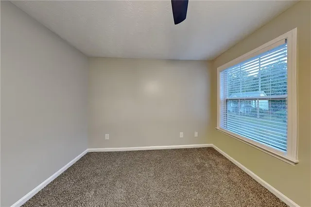 a view of a room that has a window in it