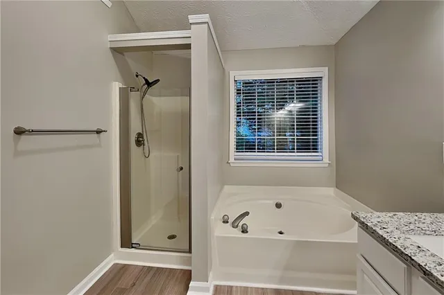 a bathroom with a bathtub and a window