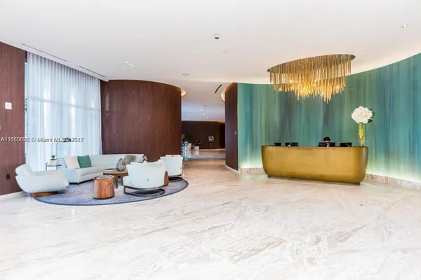 a living room with furniture and lamp