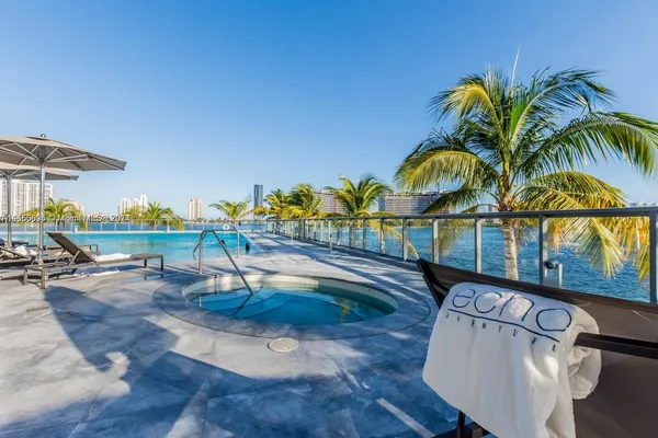 a view of swimming pool with outdoor seating