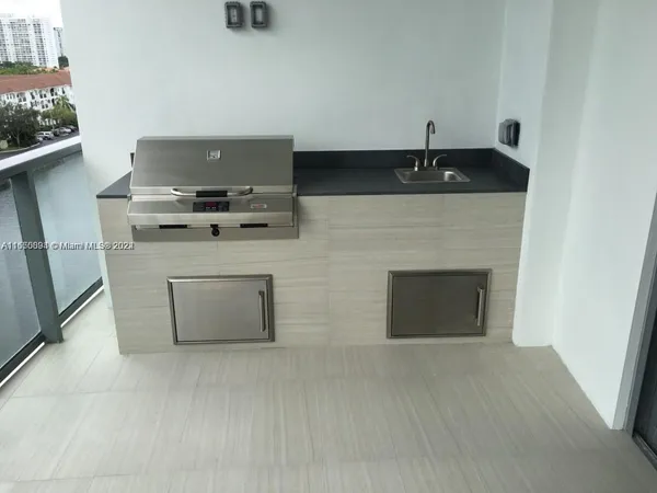 a kitchen with a stove and a microwave