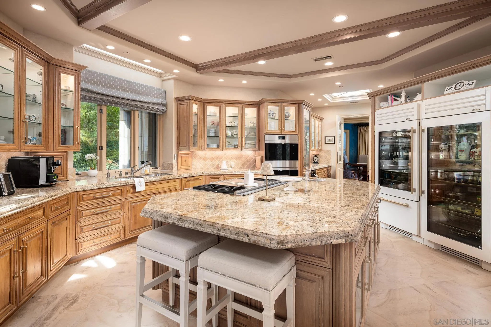 7756 St Andrews Road Rancho Santa Fe, CA 92067 - Photo 21 of 46 a large kitchen with kitchen island a sink and a stove