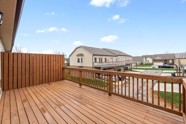 a view of balcony with wooden floor