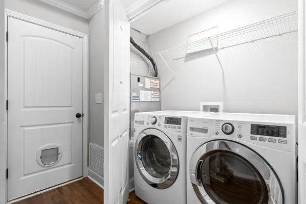 a view of storage and utility room with washer and dryer