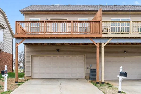 a front view of a house with a garage