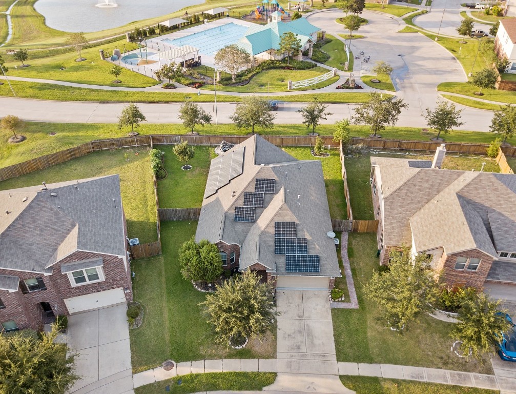 an aerial view of a house with a ocean view