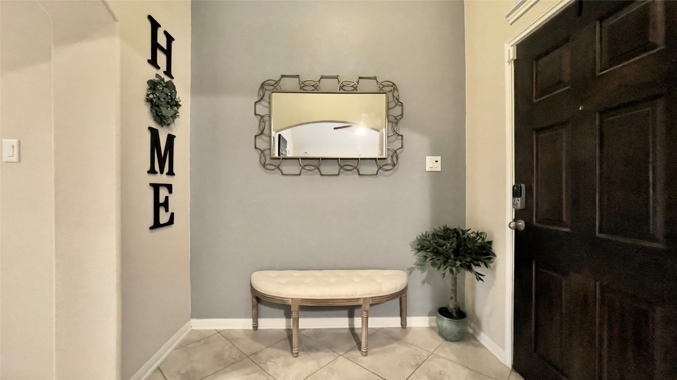 21618 Ivory Gate Lane Katy, TX 77449 - Photo 15 of 32 wooden floor with a potted plant and a mirror