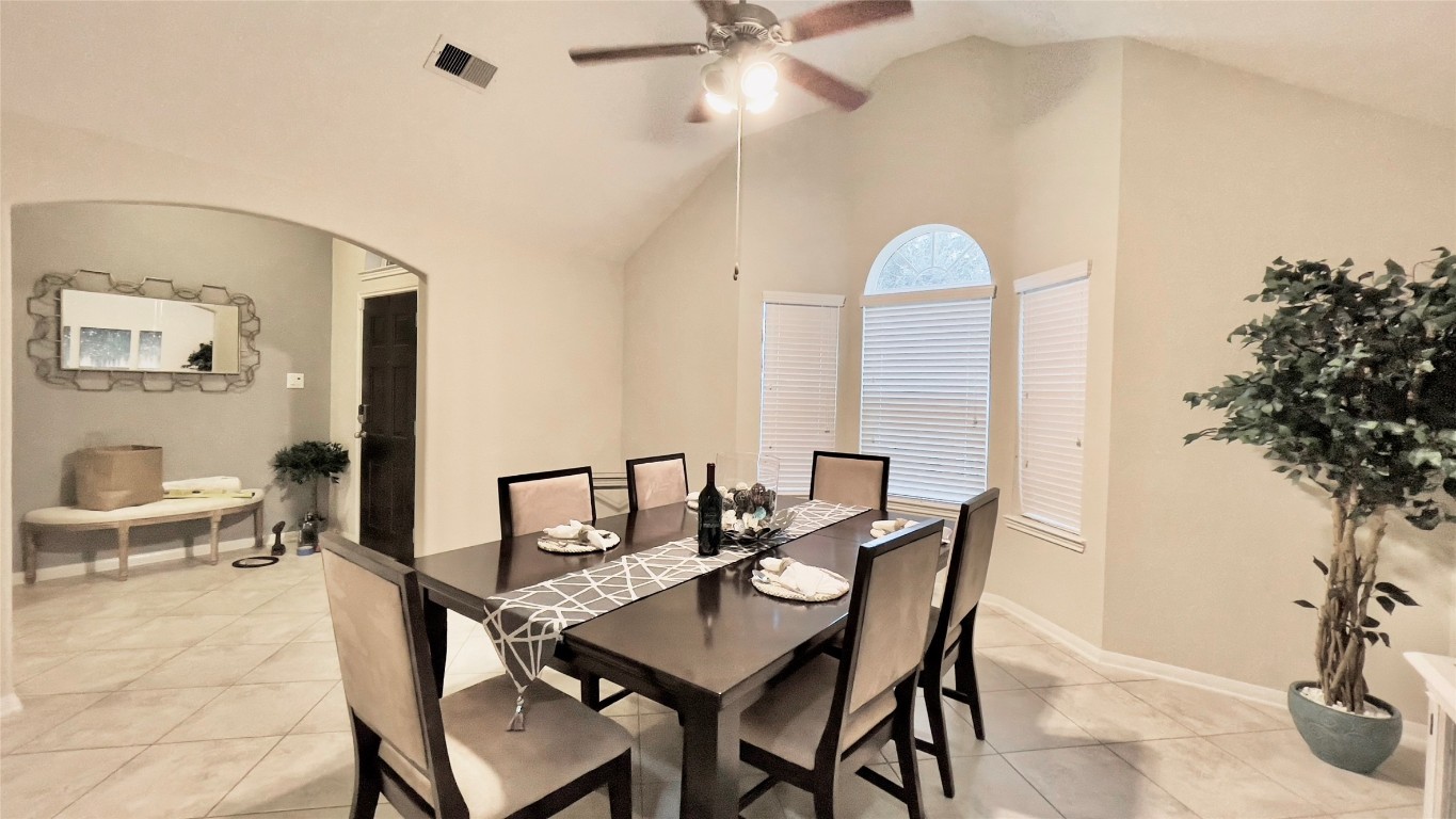 21618 Ivory Gate Lane Katy, TX 77449 - Photo 17 of 32 a view of a dining room with furniture and a potted plant