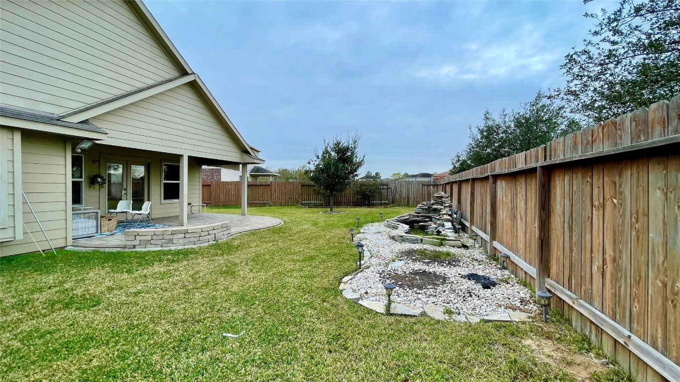 21618 Ivory Gate Lane Katy, TX 77449 - Photo 21 of 32 a view of a house with backyard porch and sitting area