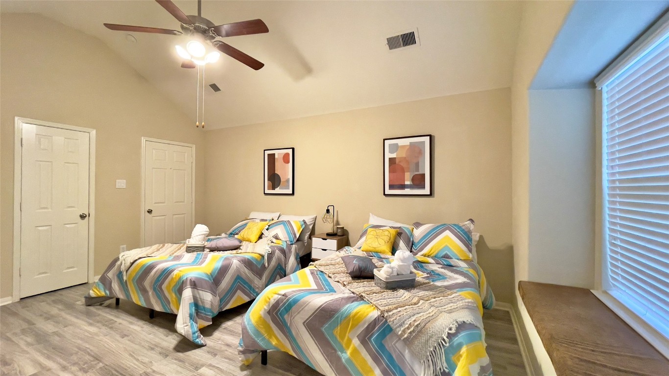 21618 Ivory Gate Lane Katy, TX 77449 - Photo 24 of 32 a bedroom with two beds and painting on the wall
