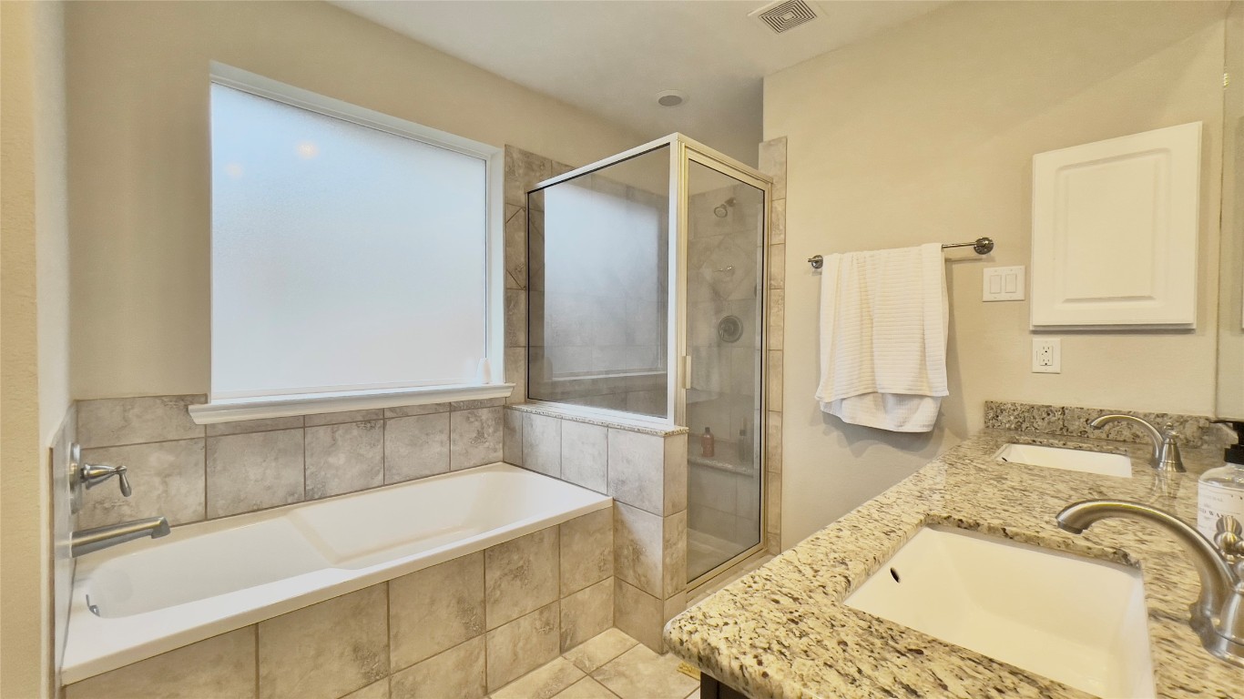 21618 Ivory Gate Lane Katy, TX 77449 - Photo 26 of 32 a bathroom with a tub sink and a shower