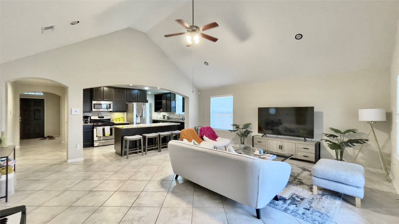 21618 Ivory Gate Lane Katy, TX 77449 - Photo 6 of 32 a living room with furniture and a flat screen tv