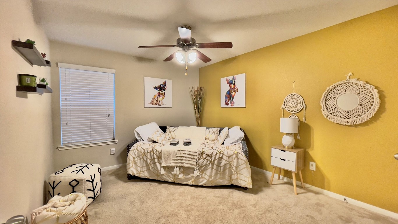 21618 Ivory Gate Lane Katy, TX 77449 - Photo 10 of 32 a bedroom with a bed and a window