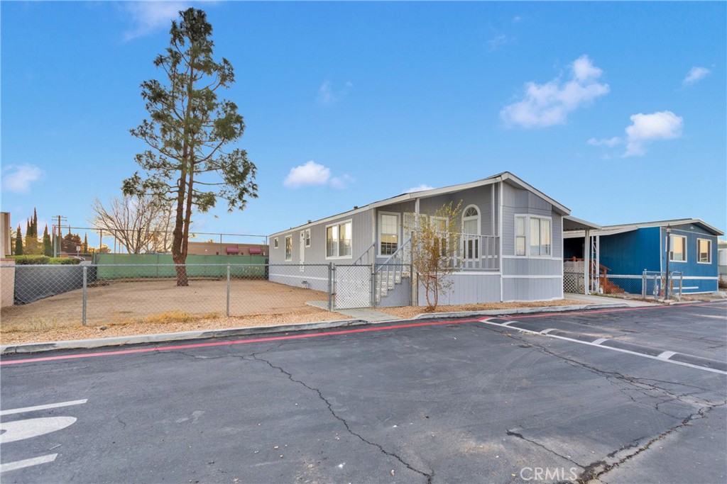 a view of a house with basketball court
