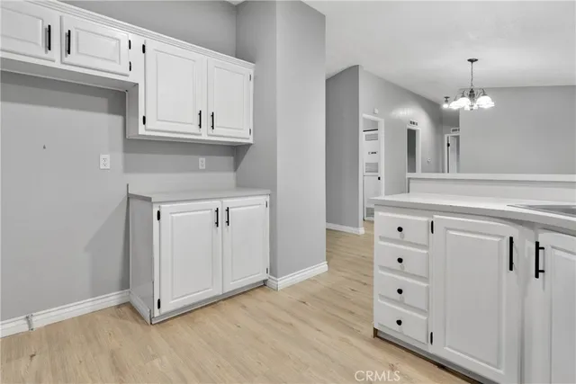 a view of cabinets and wooden floor