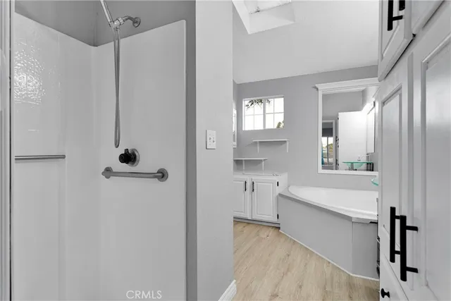 a bathroom with a bathtub and a sink
