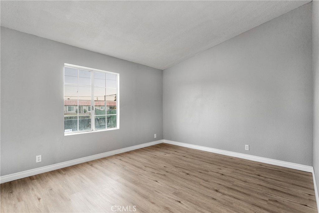 8450 G Avenue, Unit 63 Hesperia, CA 92345 - Photo 27 of 31 wooden floor in an empty room with a window