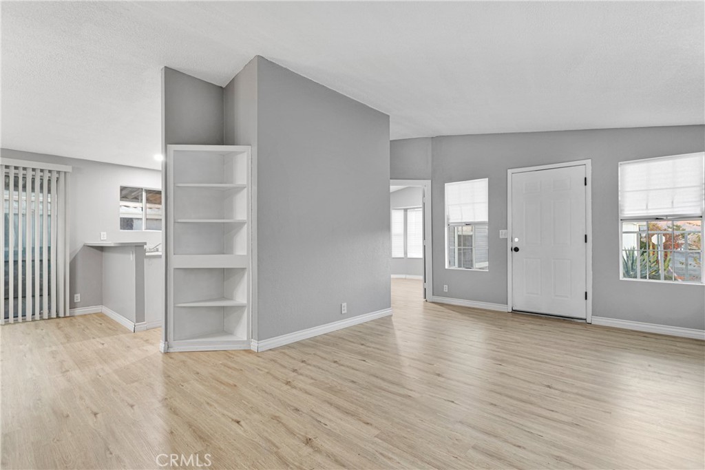 8450 G Avenue, Unit 63 Hesperia, CA 92345 - Photo 9 of 31 a view of an empty room with window and wooden floor