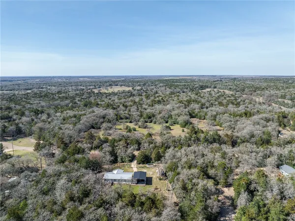 an aerial view of residential house and outdoor space