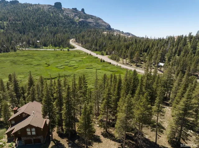 a view of a town with mountains